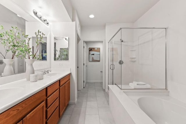 bathroom with vanity, tile patterned floors, and separate shower and tub