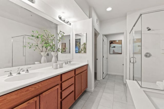 bathroom featuring vanity, an enclosed shower, and tile patterned flooring