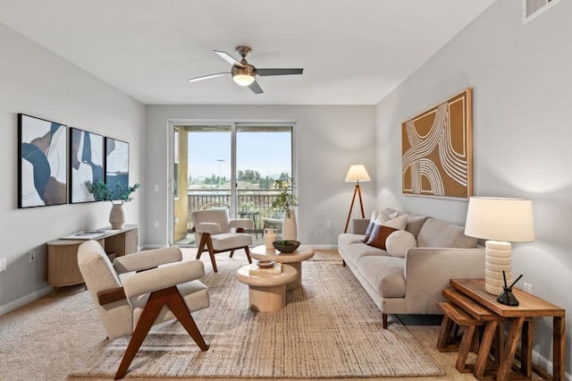 living room featuring ceiling fan and carpet floors