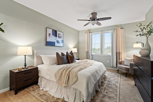 bedroom featuring light carpet and ceiling fan