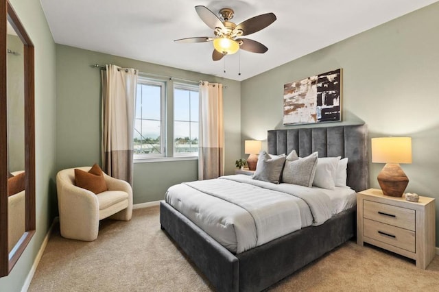 bedroom with light colored carpet and ceiling fan