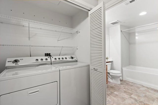 laundry room with washing machine and dryer