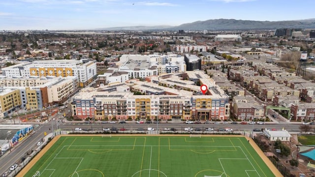 birds eye view of property featuring a mountain view