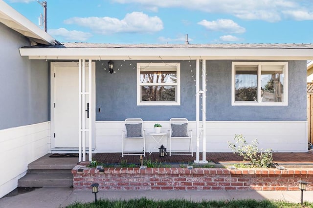 doorway to property featuring a porch