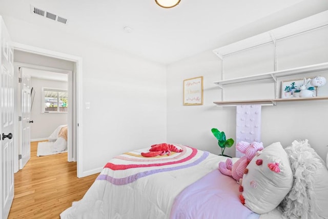 bedroom featuring light hardwood / wood-style floors