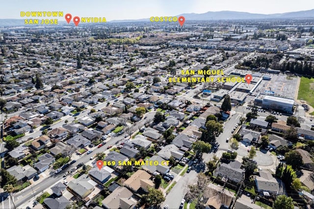 birds eye view of property featuring a mountain view