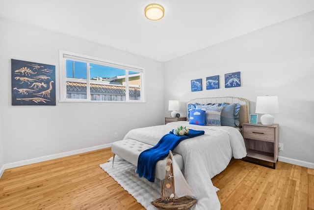 bedroom with hardwood / wood-style flooring