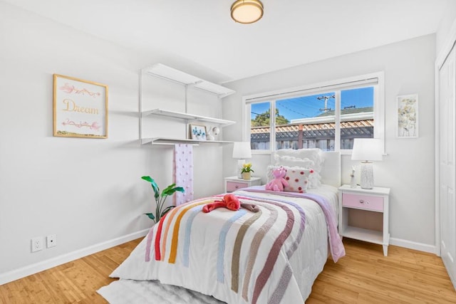 bedroom with light hardwood / wood-style floors