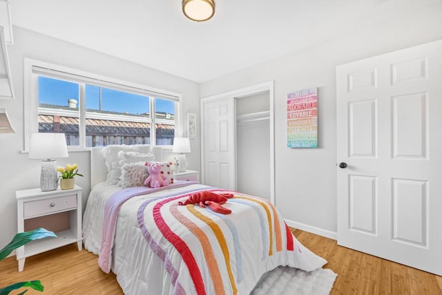 bedroom featuring a closet and light hardwood / wood-style flooring