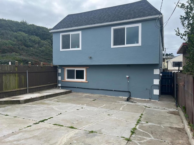 rear view of house featuring a patio