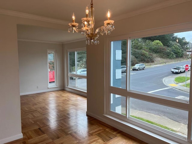 doorway featuring an inviting chandelier, parquet flooring, and ornamental molding