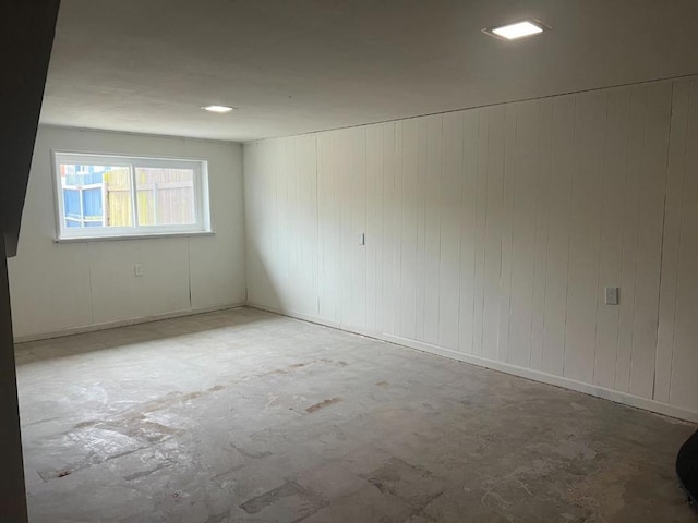 unfurnished room featuring concrete floors