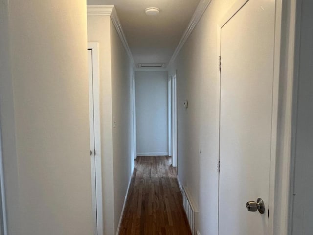 hall with crown molding and dark hardwood / wood-style flooring