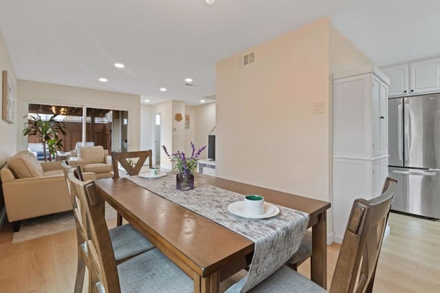 dining space featuring light hardwood / wood-style floors