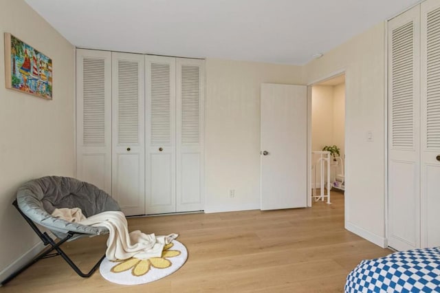 sitting room featuring light hardwood / wood-style floors