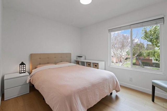 bedroom with light wood-type flooring