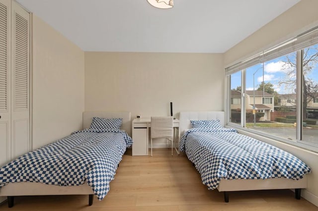 bedroom featuring light wood-type flooring