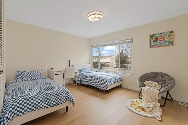 bedroom with light hardwood / wood-style floors