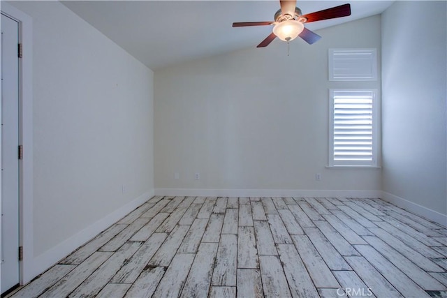 unfurnished room with lofted ceiling, light hardwood / wood-style flooring, and ceiling fan