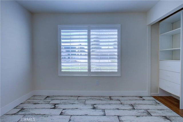 empty room with wood-type flooring