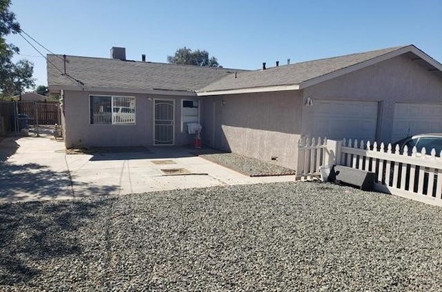 ranch-style home with a garage