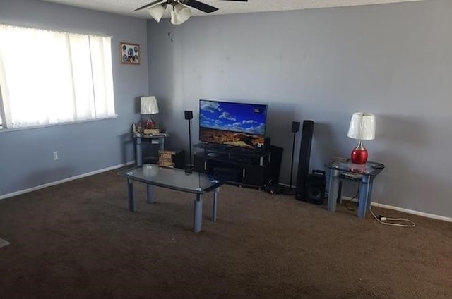 carpeted living room featuring ceiling fan