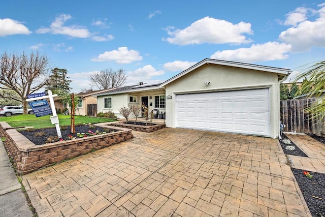 single story home featuring a garage