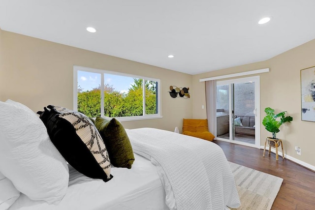 bedroom featuring dark wood-type flooring and access to outside