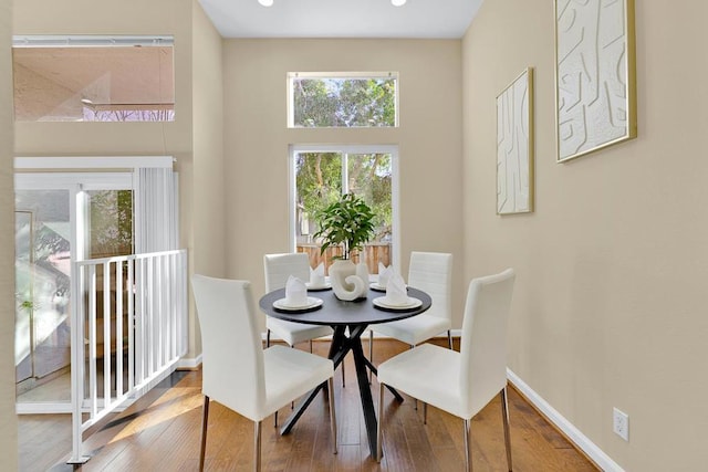 dining area with hardwood / wood-style floors