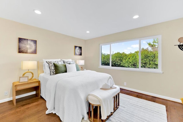 bedroom with hardwood / wood-style flooring