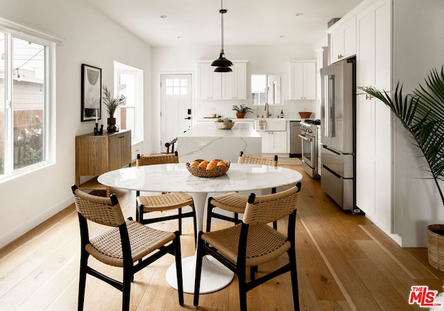 dining area with light wood-type flooring