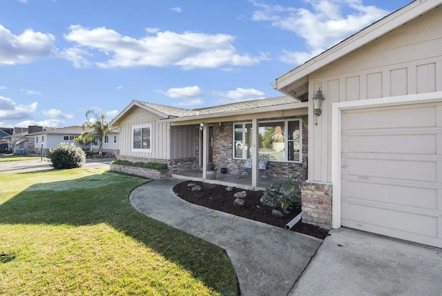 view of front of home with a garage and a front yard