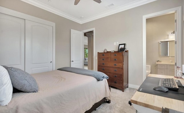 bedroom featuring connected bathroom, light carpet, visible vents, ornamental molding, and a closet