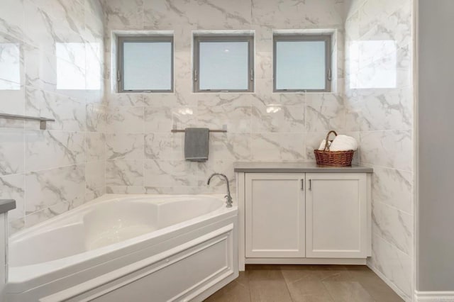 full bathroom featuring vanity and a bath