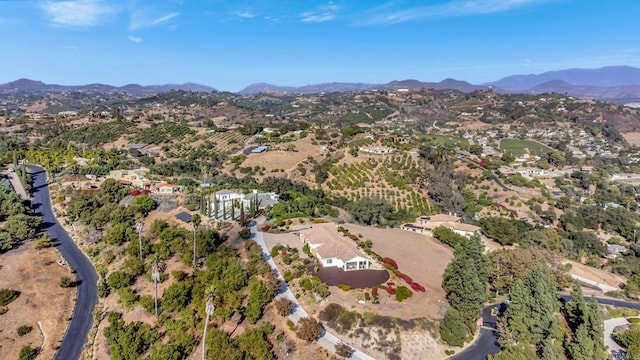 drone / aerial view featuring a mountain view