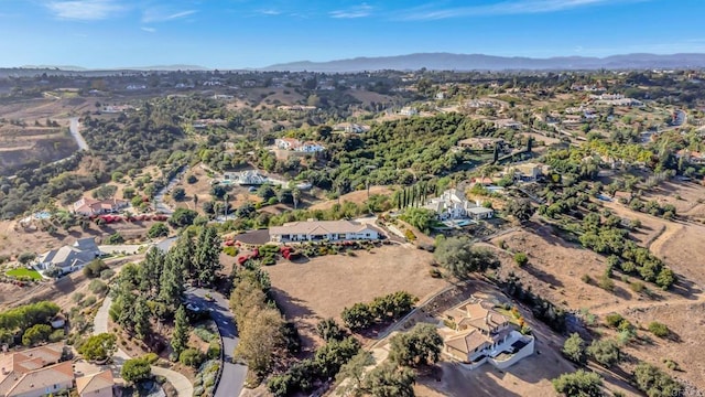 aerial view with a mountain view and a residential view