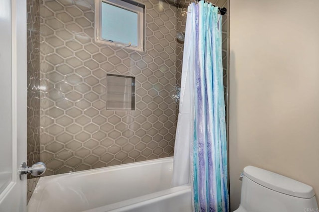 full bathroom featuring shower / bathtub combination with curtain and toilet