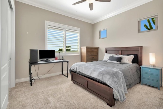 bedroom with light colored carpet, crown molding, baseboards, and ceiling fan