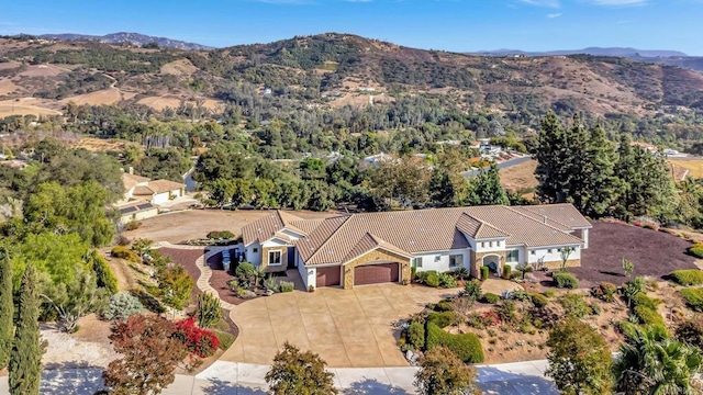 birds eye view of property with a mountain view