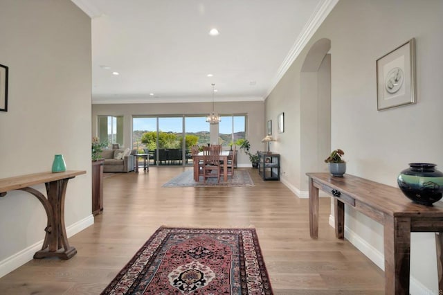3026 Via Loma, Fallbrook, CA 92028 - hallway with light wood-style flooring, crown molding, arched walkways, recessed lighting, and a chandelier