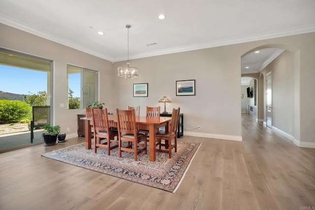 3026 Via Loma, Fallbrook, CA 92028 - dining room featuring arched walkways, light wood-style flooring, recessed lighting, ornamental molding, and a chandelier
