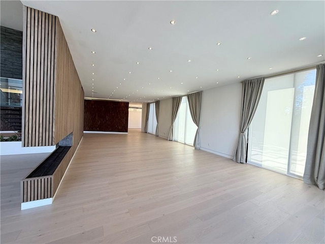 unfurnished room featuring light hardwood / wood-style floors