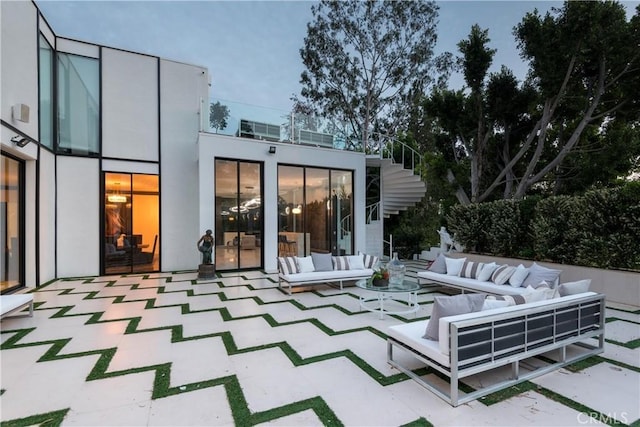 rear view of house with an outdoor hangout area and a patio