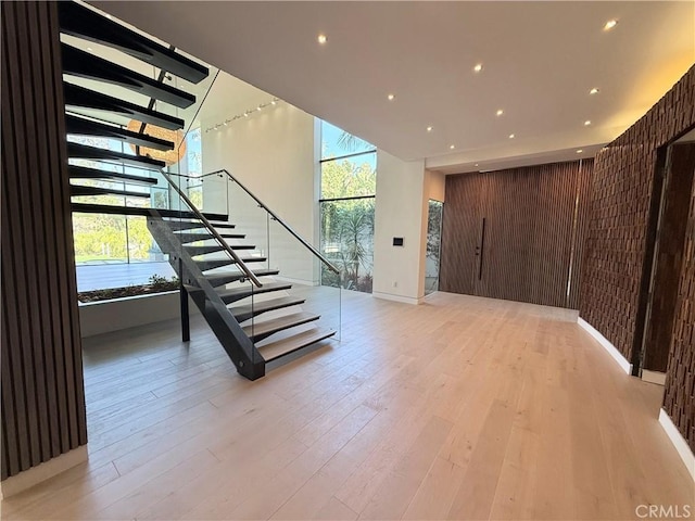 staircase featuring hardwood / wood-style flooring