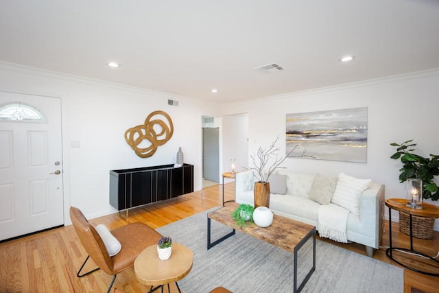 living room featuring crown molding and wood-type flooring