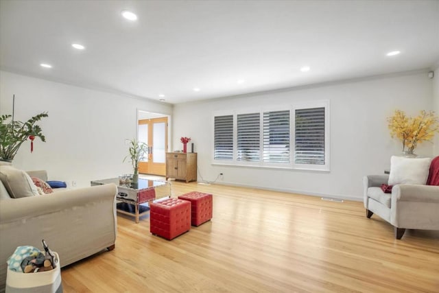 living room with light hardwood / wood-style floors