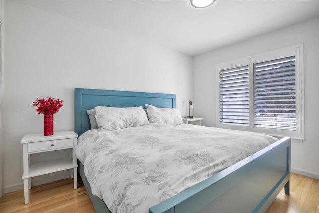 bedroom with light wood-type flooring