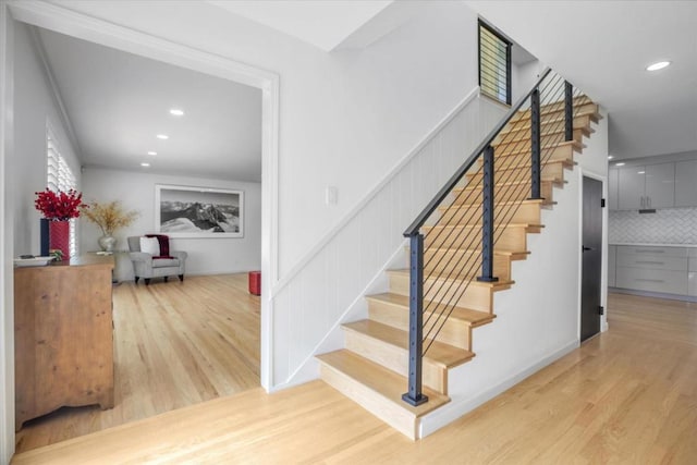 stairs with wood-type flooring