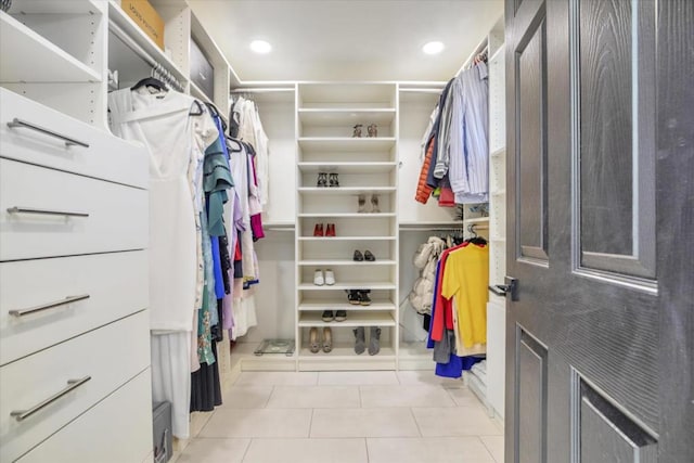 spacious closet featuring light tile patterned floors