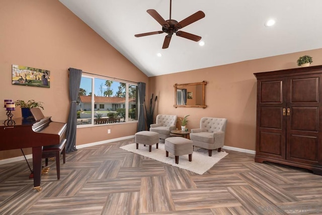 sitting room featuring ceiling fan, high vaulted ceiling, and dark parquet floors